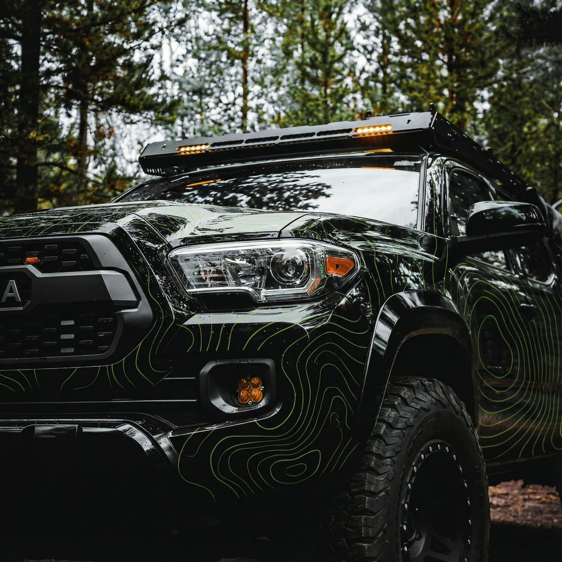 Black Toyota Tacoma with Lime Green Topo Lines