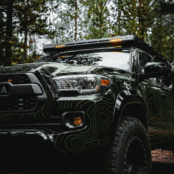 Black Toyota Tacoma with Lime Green Topo Lines