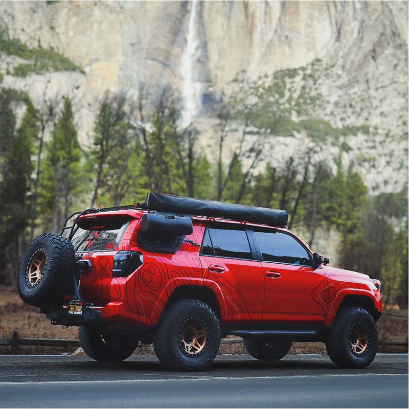 Red Toyota 4Runner with dark red topo vinyl wrap