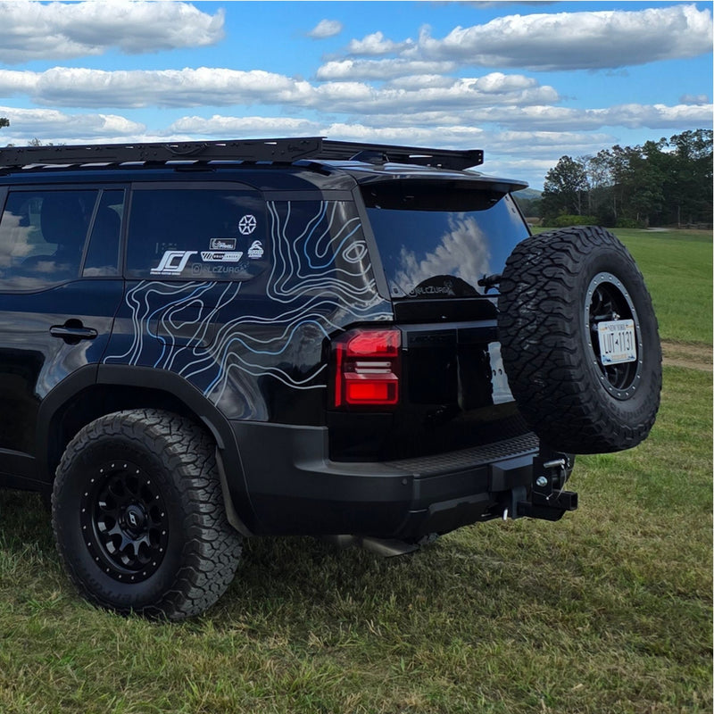 Black Toyota Land Cruiser with white and blue topo vinyl wrap